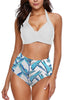 Front view of model wearing white leaf-print halter self-tie ruched high waist bikini set
