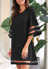 Side view of model wearing black 34 bell sleeves mesh panel crew-neckline loose dress
