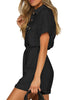 Side view of model wearing black short sleeves button-down belted rompers