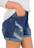 Side view of model wearing dark blue roll-over ripped washed denim shorts