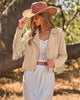 Beige Women's Cropped Fringe Faux Suede Jacket — Trendy Zip Up Tassel Cowgirl Jacket with Full Lining & Faux Leather Finish