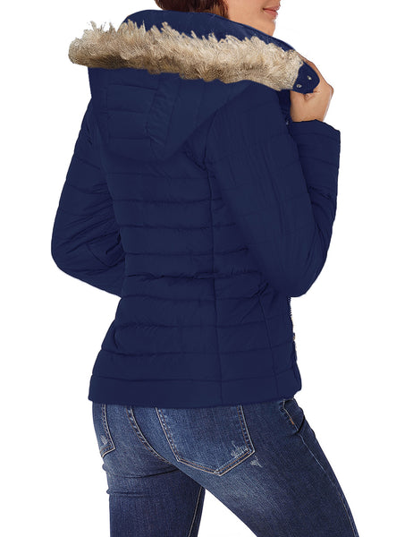 Back view of model wearing navy blue faux fur hooded zip up quilted jacket