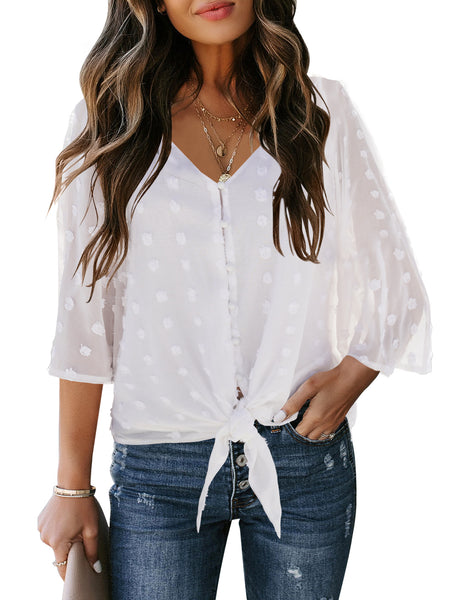 Front view of model wearing white swiss dot 3/4 sleeves tie-front button down top