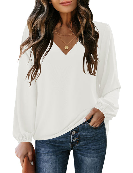 Front view of model wearing white V-neckline bishop sleeves loose fit women's top