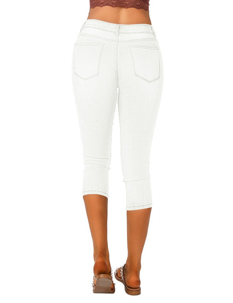 Back view of model wearing white below knee skinny fit denim jeans shorts