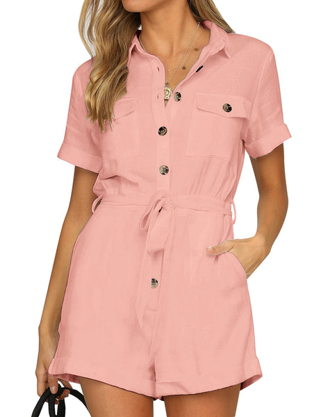 Front view of model wearing blush pink short sleeves button-down belted romper