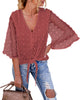 Model wearing blush 3/4 sleeves pompom tie-front top