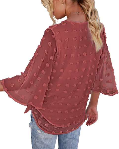 Back view of model wearing blush 3/4 sleeves pompom tie-front top