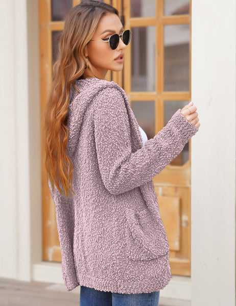 Side view of model wearing deep blush button down melange waffle knit hooded cardigan