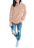 Full body shot of model wearing blush split cowl neck plaid fleece sweater top