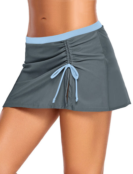 Angled view of model wearing light grey elastic waist slit side-drawstring skirtini bottom