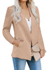Angled shot of model wearing light brown open-front side pockets blazer