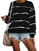 Model wearing black striped drop shoulder pullover sweater