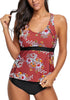 Front view of model wearing dark coral racerback floral tankini set