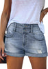 Frontal view of model wearing blue high-waist double button cuffed hem ripped denim shorts