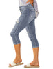 Side view of model wearing sky blue below-knee cropped skinny denim jeans