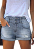 Model wearing blue high-waist double button cuffed hem ripped denim shorts