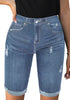 Model wearing light blue mid-waist cuffed hem distressed denim bermuda shorts