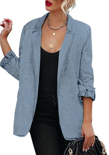 Front view of model wearing light blue lapel collar flap pockets open-front denim blazer