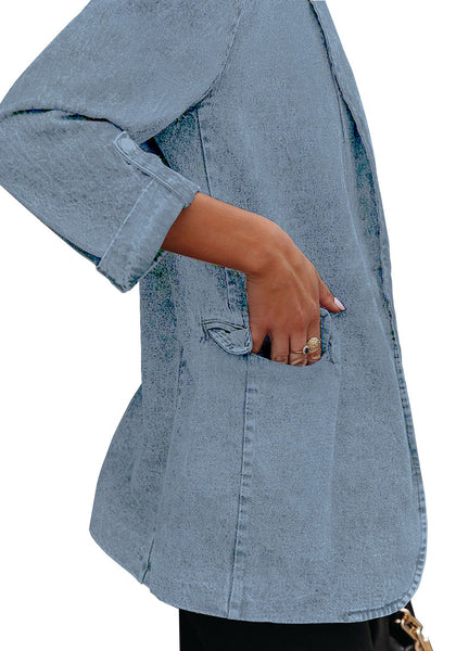 Closeup view of model wearing light blue lapel collar flap pockets open-front denim blazer