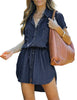 Model wearing dark blue elastic waist curved hem button down denim shirt dress