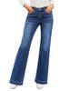 Model wearing dark blue mid-waist stretchable straight leg denim jeans