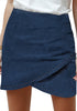 Front view of model wearing dark blue acid wash tulip ruched denim mini skirt