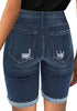 Back view of model wearing dark blue mid-waist cuffed hem distressed denim bermuda shorts
