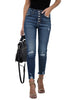 Model poses wearing blue high-waist button-up frayed raw hem ripped cropped jeans