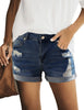 Front view of model wearing blue mid-waist rolled hem distressed denim shorts