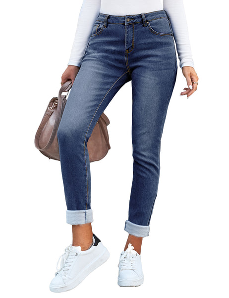 Posing model wearing blue mid-waist skinny fit denim jeans