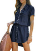 Front view of model wearing dark blue elastic waist curved hem button down denim shirt dress