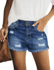 Front view of model wearig dark blue double button frayed hem ripped denim shorts