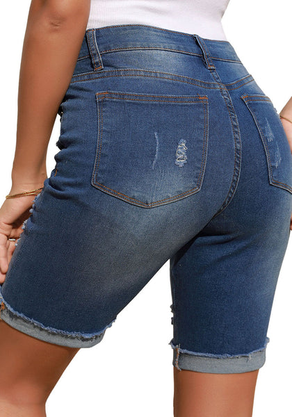 Back view of model wearing dark blue plus size mid-waist ripped denim bermuda shorts
