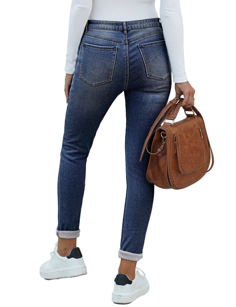 Back view of model wearing dark blue fleece-lined button-down denim skinny jeans