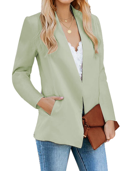 Angled view of model wearing mint green open-front side pockets blazer.