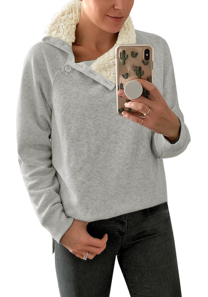 Mirror selfie of woman in light grey split cowl collar long sleeves pullover top
