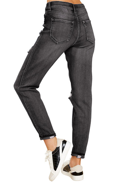 Back view of model wearing dark grey cuffed ripped denim boyfriend jeans