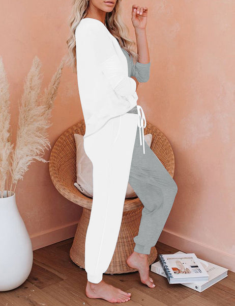 Side view of model wearing white colorblock drawstring-waist jogger pajama set