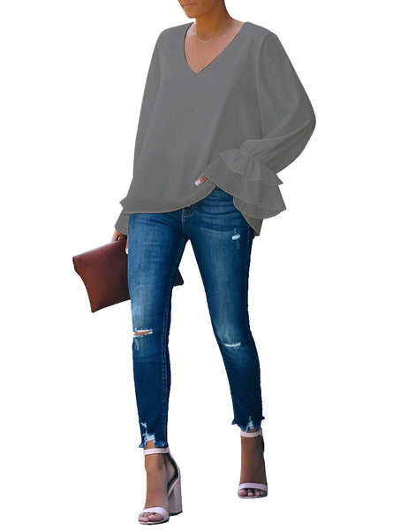 Full front view of model wearing grey ruffle cuff long sleeves V-neck blouse