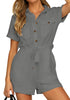 Front view of model wearing grey short sleeves button-down belted romper