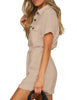 Side view of model wearing light mauve short sleeves button-down belted romper