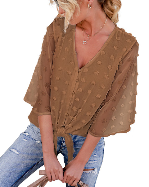 Model poses wearing coffee 3/4 sleeves pompom tie-front top