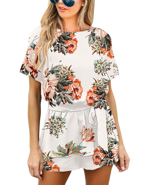 Front view of model wearing white floral short sleeves keyhole-back belted romper