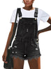 Front view of model wearing black frayed raw hem denim shorts overall