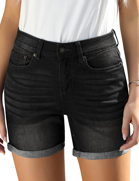 Front view of model wearing black rolled hem slim fit denim shorts