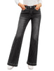 Model wearing black mid-waist stretchable straight leg denim jeans