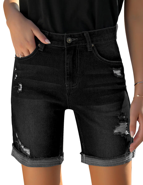 Front view of model wearing black rolled hem distressed biker shorts