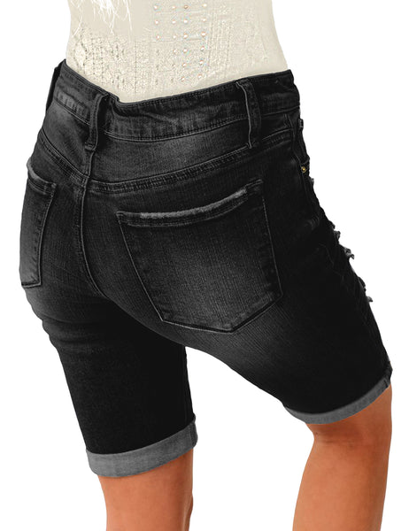 Back view of model wearing black women mid-waist frayed bermuda denim shorts