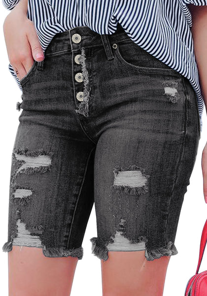 Model poses wearing black frayed hem ripped button-up denim bermuda shorts
